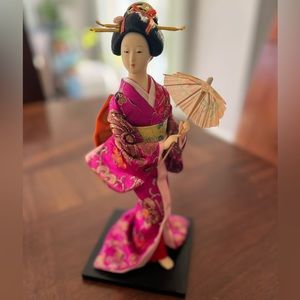 Beautiful Japanese Doll in Kimono with umbrella